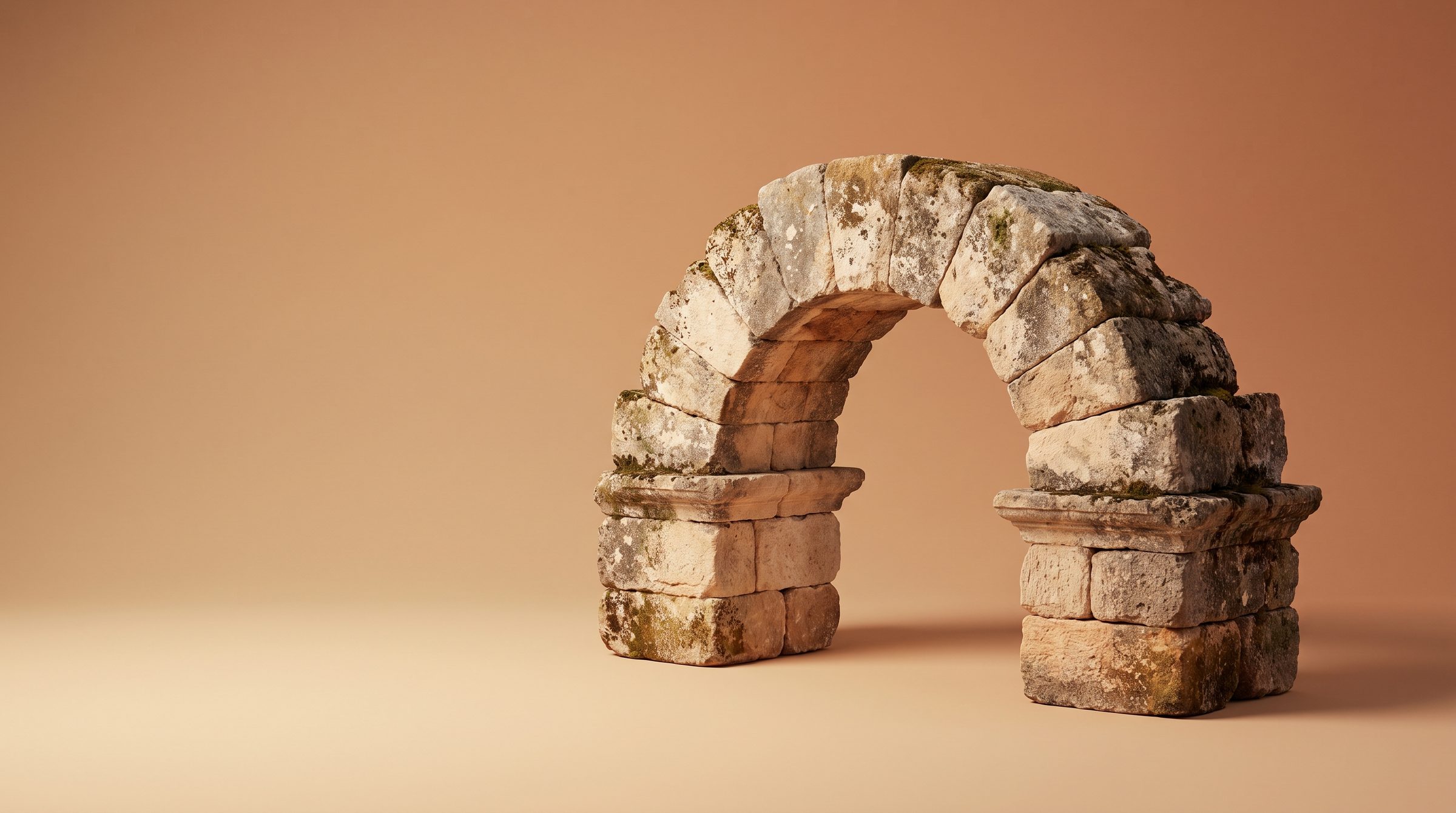 An ancient Roman stone arch, every block still in place, in low golden light